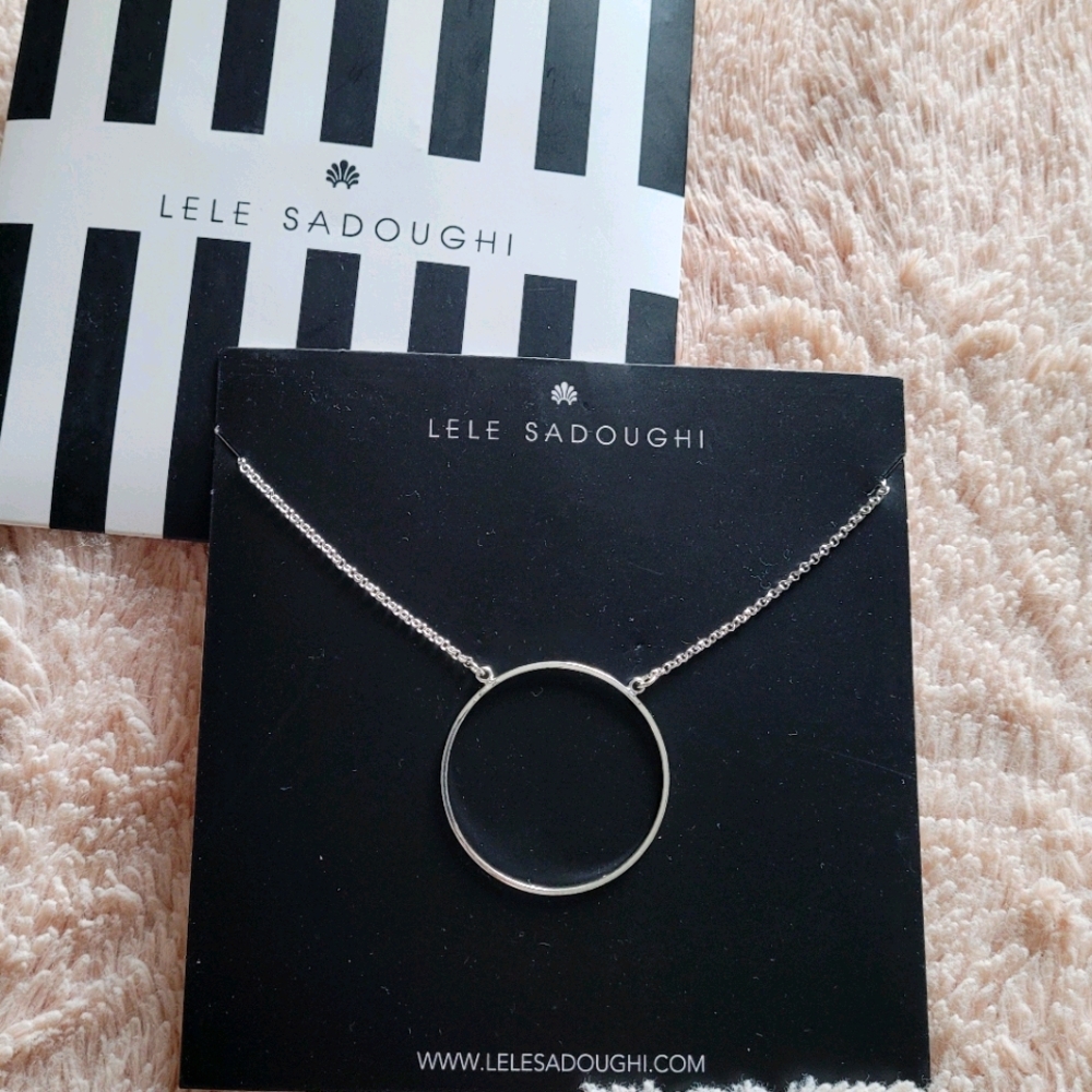 Neck with circle charm.